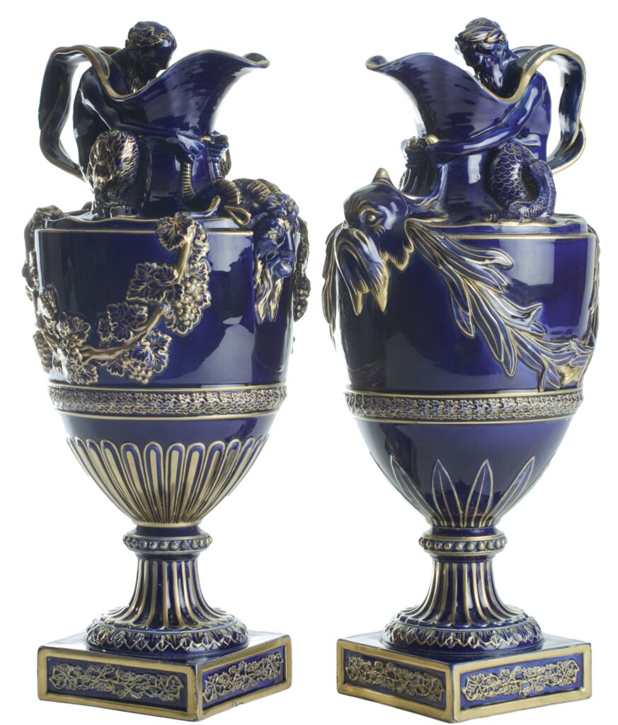 Twin dark blue and gold majolica ewers.