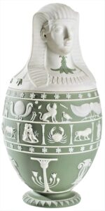 Light green jasper vase with top in the form of a pharaoh's head, with hieroglyphs and zodiac symbols on the sides.